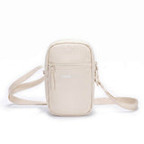Zeeksack Travel Pouch (sand white) – skulderrem og forlomme med lynlås.